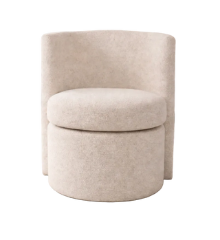 Beige swivel chair in a living room setting with a couch and plant in the background.